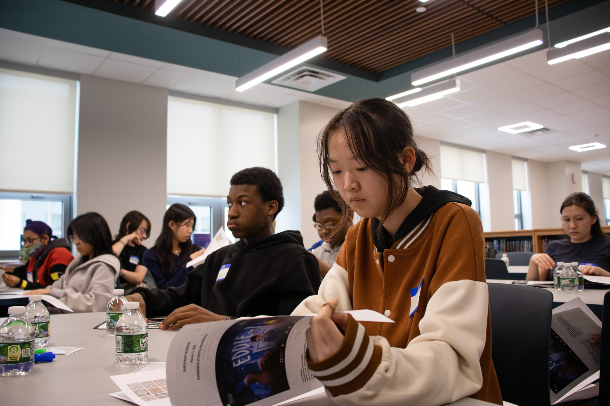 Students reviewing workshop materials