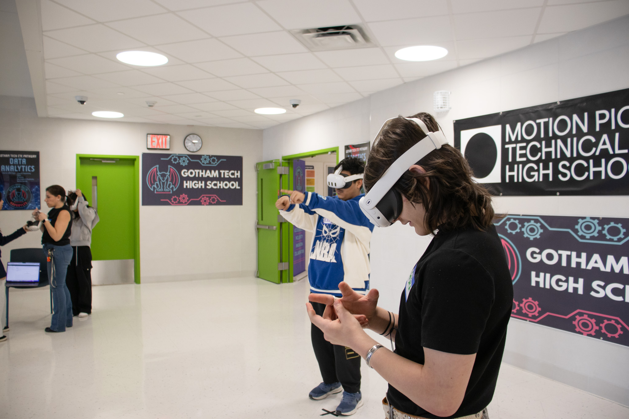 Students with VR headsets in school hallway